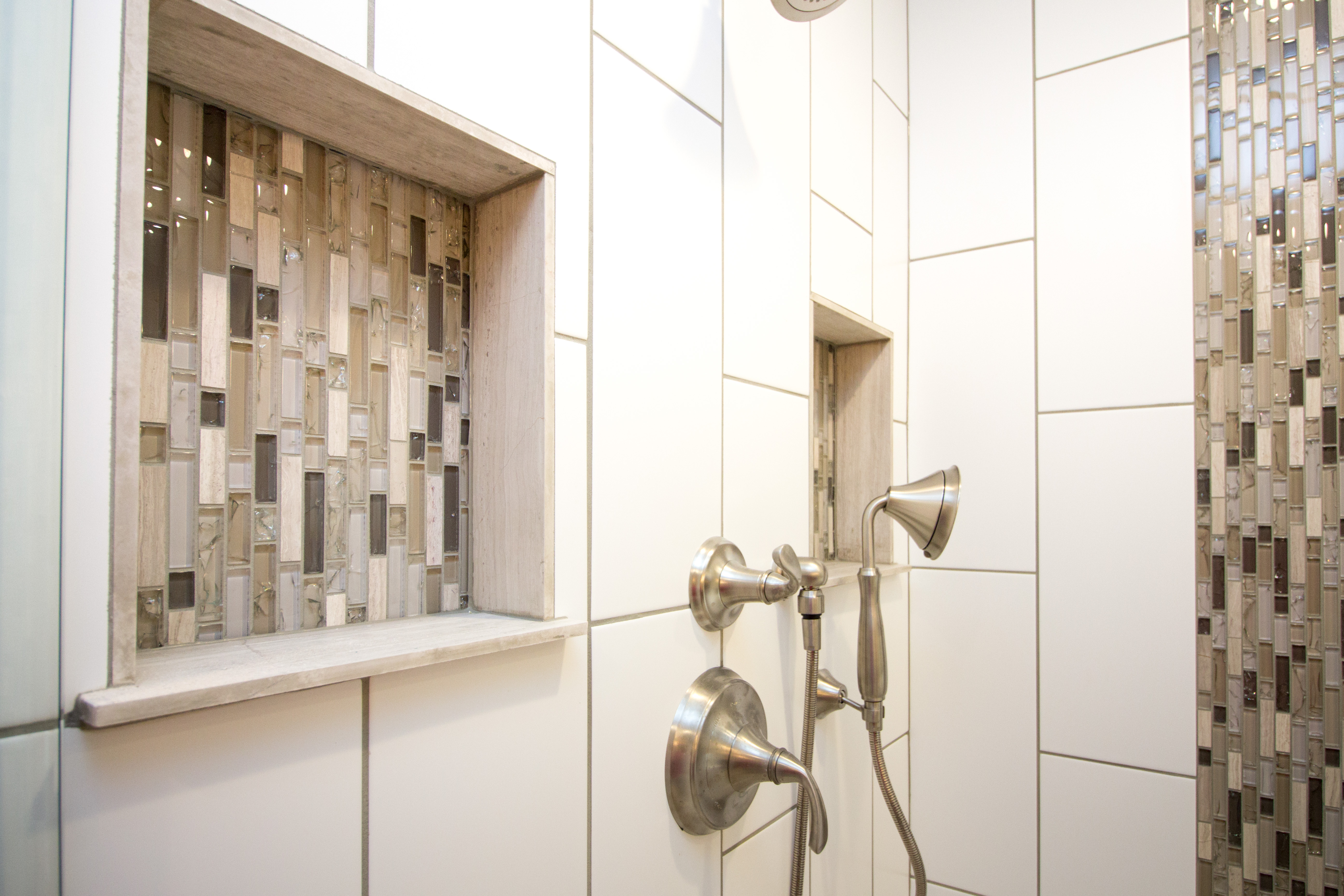 modern shower fixtures with white tiled walls